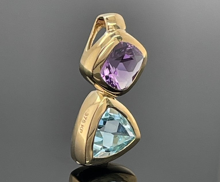ANHÄNGER AUS 375/- GELBGOLD MIT AMETHYST & BLAUTOPAS
