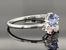 RING AUS 375/- WEIßGOLD MIT TANSANIT, GRANAT & DIAMANTEN
