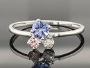 RING AUS 375/- WEIßGOLD MIT TANSANIT, GRANAT & DIAMANTEN