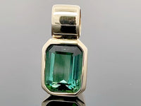 ANHÄNGER AUS 375/- GELBGOLD MIT GOLKONDA TURMALIN (CA. 1,10 ct.)