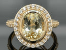 RING AUS 375/- GELBGOLD MIT HIDDENIT & ZIRKON (ges. ca. 4,79ct.)