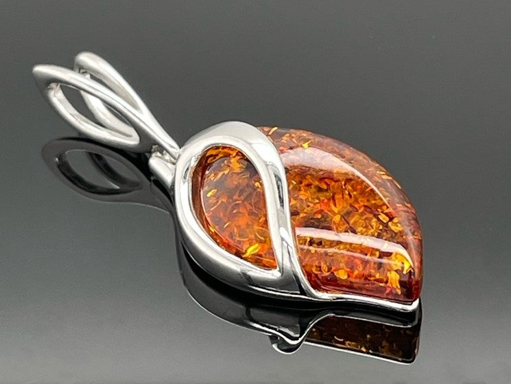 ANHÄNGER AUS 925/- SILBER RHODINIERT MIT BERNSTEIN ( CA. 3,50 ct.)