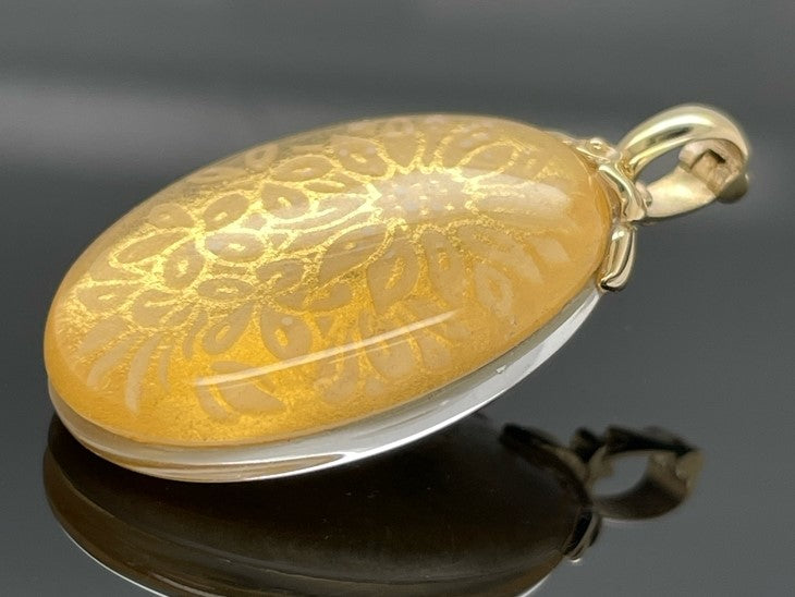 CLIP ANHÄNGER AUS 375/- GELBGOLD MIT BERGKRISTALL/BLATTGOLD-DUBL. BEH.