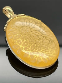 CLIP ANHÄNGER AUS 375/- GELBGOLD MIT BERGKRISTALL/BLATTGOLD-DUBL. BEH.