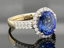 RING AUS 585/- GELBGOLD MIT TANSANIT AAAA (CA. 2,90 ct.) & BRILLANTEN (GES. CA. 0,50 ct.)