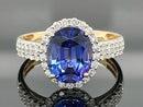 RING AUS 585/- GELBGOLD MIT TANSANIT AAAA (CA. 2,90 ct.) & BRILLANTEN (GES. CA. 0,50 ct.)