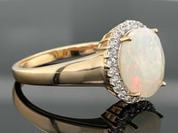 RING AUS 925/- SILBER VERGOLDET MIT ÄTHIOP. OPAL & ZIRKON