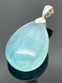CLIP ANHÄNGER AUS 925/- SILBER RHODINIERT MIT MILKY AQUAMARIN (CA.31,0 ct.)