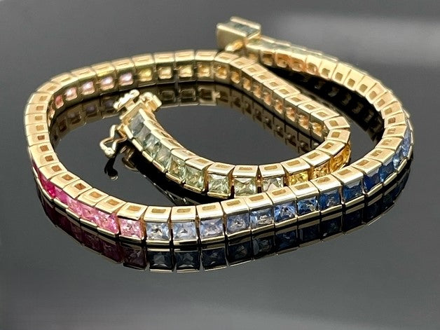 ARMBAND AUS 375/- GELBGOLD MIT MULTI SAPHIR (GES.CA. 7,92 ct.)