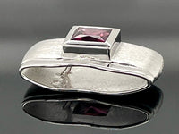GLEITER AUS 925/- SILBER RHODINIERT MIT RHODOLITH (CA.0,82 ct.)
