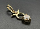 ANHÄNGER "STIER" AUS 375/- GELBGOLD MIT TOPAS & DIAMANT (GES. CA. 0,28 ct.)