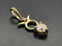 ANHÄNGER "STIER" AUS 375/- GELBGOLD MIT TOPAS & DIAMANT (GES. CA. 0,28 ct.)