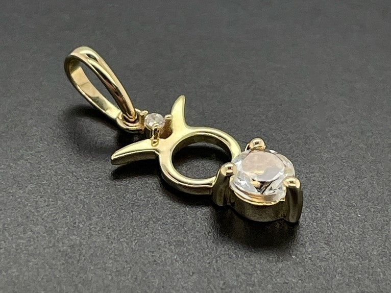 ANHÄNGER "STIER" AUS 375/- GELBGOLD MIT TOPAS & DIAMANT (GES. CA. 0,28 ct.)