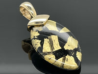 CLIP ANHÄNGER AUS 375/- GELBGOLD MIT BERGKRISTALL/ONYX/BLATTGOLD-DUBL. BEH. (CA. 13,0 ct.)