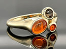 RING AUS 375/- GELBGOLD MIT FEUEROPAL & RAUCHQUARZ (GES.CA. 0,73 ct.)