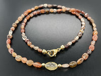COLLIER 375/- GELBGOLD MIT MULTI ZIRKON , BK/BLATTG.-DUBL. BEH. & HÄMATIT