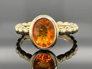 RING AUS 375/- GELBGOLD MIT FEUEROPAL (CA. 0,66 ct.)