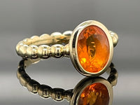 RING AUS 375/- GELBGOLD MIT FEUEROPAL (CA. 0,66 ct.)