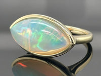 RING AUS 585/- GELBGOLD MIT KRISTALLOPAL ( CA.4,53 ct.)
