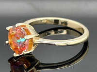 RING GR. 17 (CA.53) AUS 375/- GELBGOLD MIT TOPAS BEH.