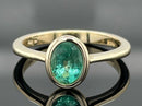 RING AUS 375/- GELBGOLD MIT SAMBIA SMARAGD (CA. 0,52 ct.)