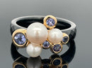RING SET GR. 17 (CA.53) AUS 375/- GELBGOLD & KERAMIK MIT TANSANIT & SWZP