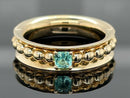 DREHRING AUS 375/- GELBGOLD MIT PARAIBATURMALIN (ca. 0,14 ct.)
