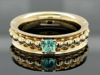 DREHRING AUS 375/- GELBGOLD MIT PARAIBATURMALIN (ca. 0,14 ct.)