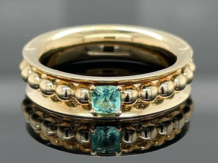 DREHRING AUS 375/- GELBGOLD MIT PARAIBATURMALIN (ca. 0,14 ct.)