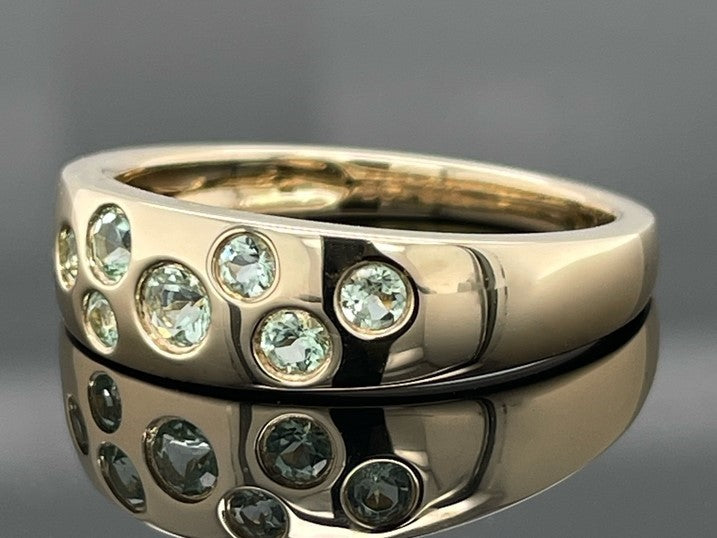 RING AUS 375/- GELBGOLD MIT PARAIBA-TURMALIN (ges.ca. 0,45 ct.)