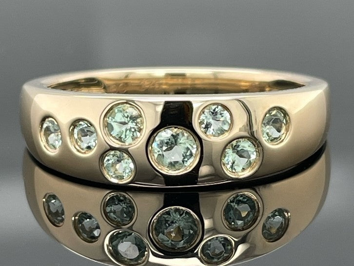 RING AUS 375/- GELBGOLD MIT PARAIBA-TURMALIN (ges.ca. 0,45 ct.)