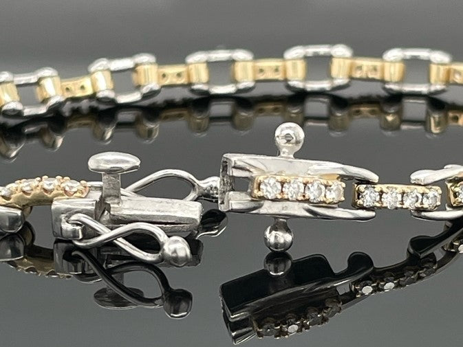 ARMBAND 950/-PLATIN & 585/- GELBGOLD MIT  BRILLANTEN LR (GES.MIND. CA.1,00 ct.)