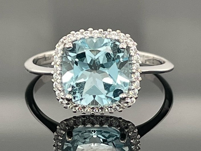 RING AUS 375/- WEIßGOLD MIT BLAUTOPAS & ZIRKONIA