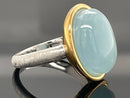 RING AUS 925/- SILBER BICOLOR MIT MILKY AQUAMARIN (CA. 7,0 ct.)