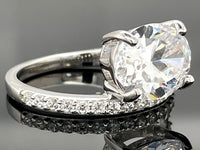 RING AUS 925/- SILBER RHODINIERT MIT ZIRKONIA