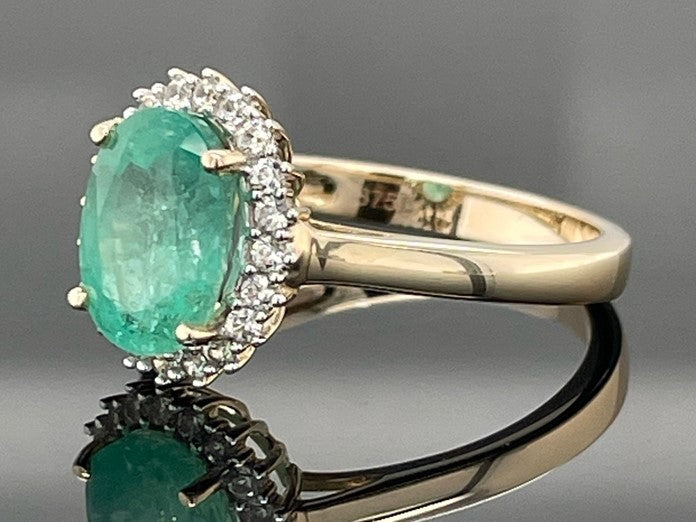 RING AUS 375/- GELBGOLD MIT SAMBIA SMARAGD & ZIRKON ( GES. CA. 1,83 ct.)