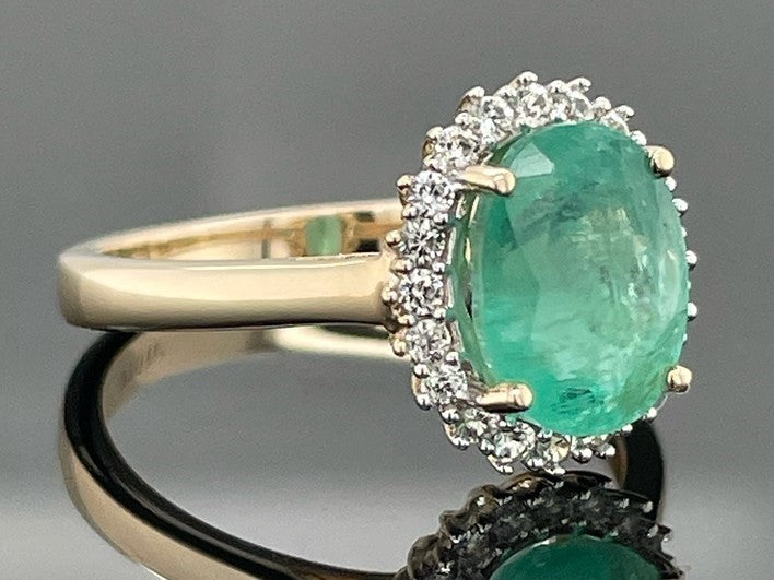 RING AUS 375/- GELBGOLD MIT SAMBIA SMARAGD & ZIRKON ( GES. CA. 1,83 ct.)