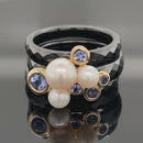 RING SET GR. 17 (CA.53) AUS 375/- GELBGOLD & KERAMIK MIT TANSANIT & SWZP