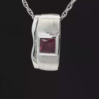 GLEITER AUS 925/- SILBER RHODINIERT MIT RHODOLITH (CA.0,82 ct.)