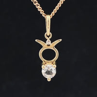 ANHÄNGER "STIER" AUS 375/- GELBGOLD MIT TOPAS & DIAMANT (GES. CA. 0,28 ct.)