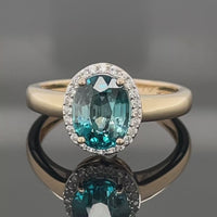 RING AUS 375/- GELBGOLD MIT ZIRKON BLAU & WEIß (ges.ca.3,07 ct.)