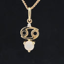 ANHÄNGER "KREBS" AUS 375/- GELBGOLD MIT MONDSTEIN & DIAMANT (GES. CA. 0,24 ct.)