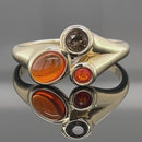 RING AUS 375/- GELBGOLD MIT FEUEROPAL & RAUCHQUARZ (GES.CA. 0,73 ct.)