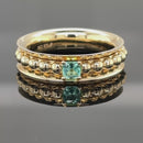DREHRING AUS 375/- GELBGOLD MIT PARAIBATURMALIN (ca. 0,14 ct.)