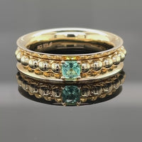 DREHRING AUS 375/- GELBGOLD MIT PARAIBATURMALIN (ca. 0,14 ct.)