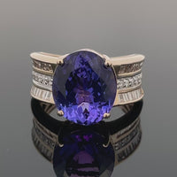 RING GR.16 (50) AUS 585/- GELBGOLD MIT TANSANIT AAAAA & BRILLANTEN (GES. CA. 0,55ct.)