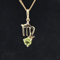 ANHÄNGER "JUNGFRAU" AUS 375/- GELBGOLD MIT PERIDOT & DIAMANT (GES. CA. 0,28 ct.)