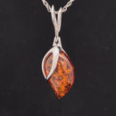ANHÄNGER AUS 925/- SILBER RHODINIERT MIT BERNSTEIN ( CA. 3,50 ct.)