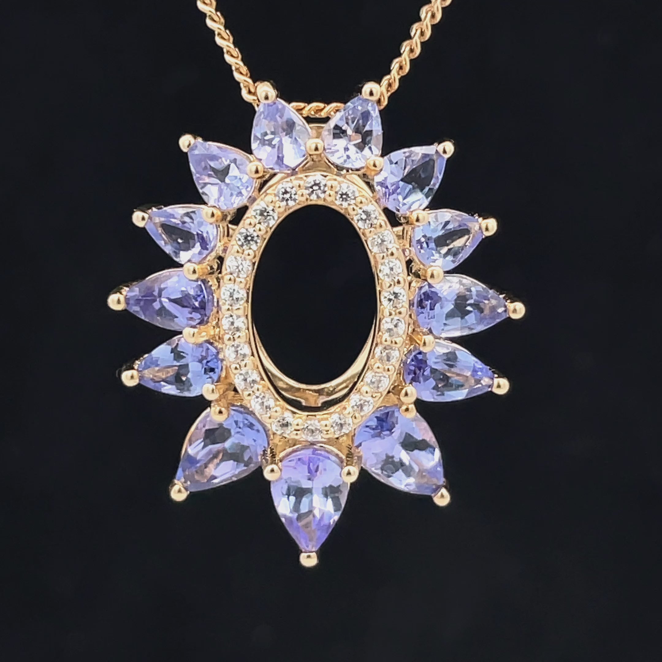 ANHÄNGER AUS 375/- GELBGOLD MIT TANSANIT & ZIRKON ( GES. CA. 3,014 ct.)