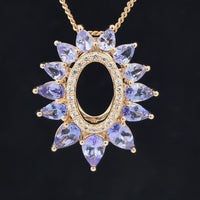 ANHÄNGER AUS 375/- GELBGOLD MIT TANSANIT & ZIRKON ( GES. CA. 3,014 ct.)